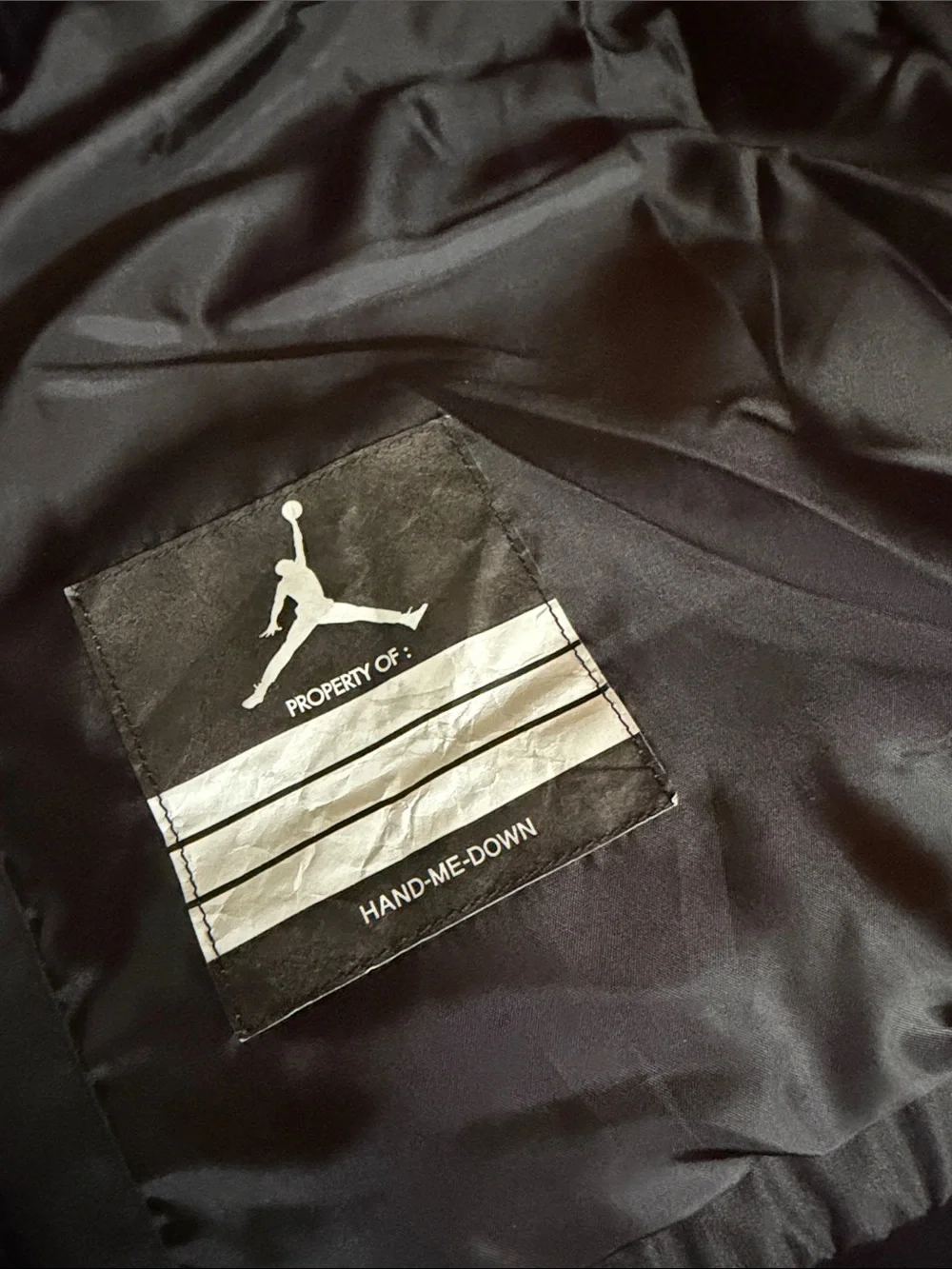 Jordan boys size xl Black Puffer Vest with White logo on front.